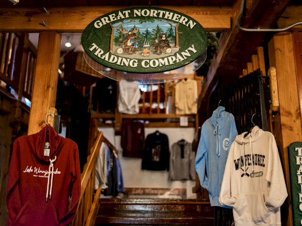 The image shows the interior of a store named "Great Northern Trading Company" with clothing items like hoodies and sweaters on display.